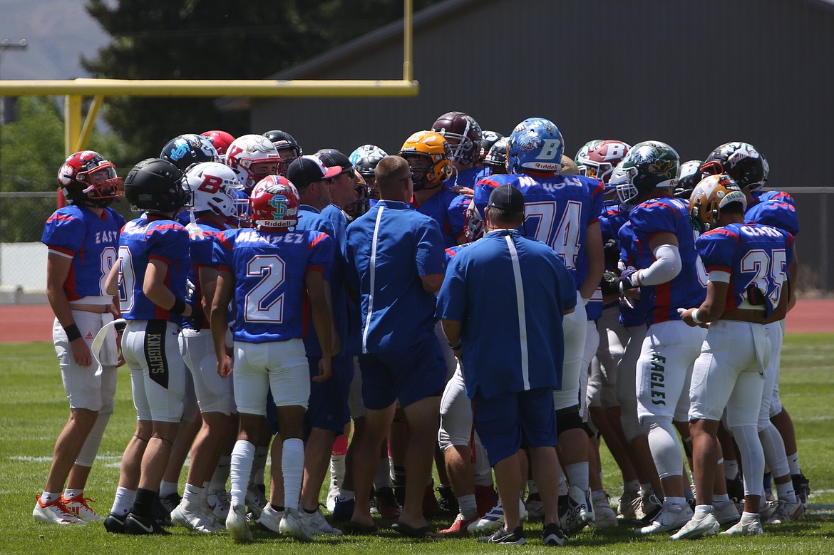 Players from the East huddle up before playing in Saturday’s Earl Barden Classic at East Valley High School in Yakima. Representing the Columbia Basin in the game were Ephrata’s Eric O’Neel, Othello’s Alex Mendez and Royal’s Bennett Brown and Case Christensen.