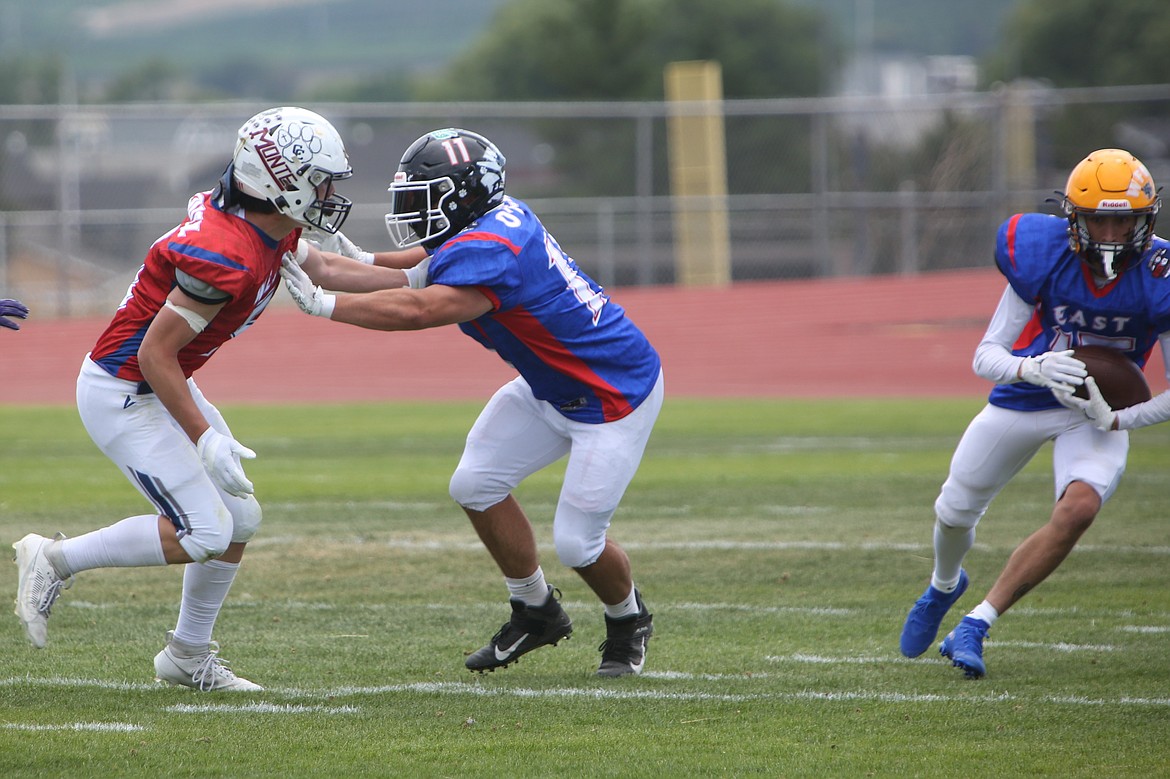 Ephrata’s Eric O’Neel (11) blocks for a teammate during Saturday’s Earl Barden Classic in Yakima. O’Neel played four positions for the East in the game – tight end, linebacker, kicker and punter.