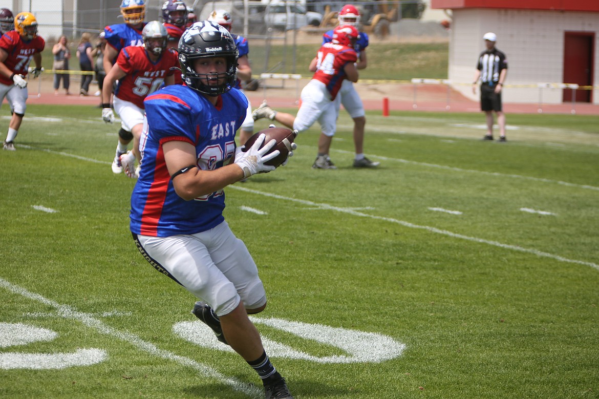 Royal’s Bennett Brown, foreground, catches a pass in the first half of Saturday’s Earl Barden Classic in Yakima. Brown caught two passes for seven yards in the game.