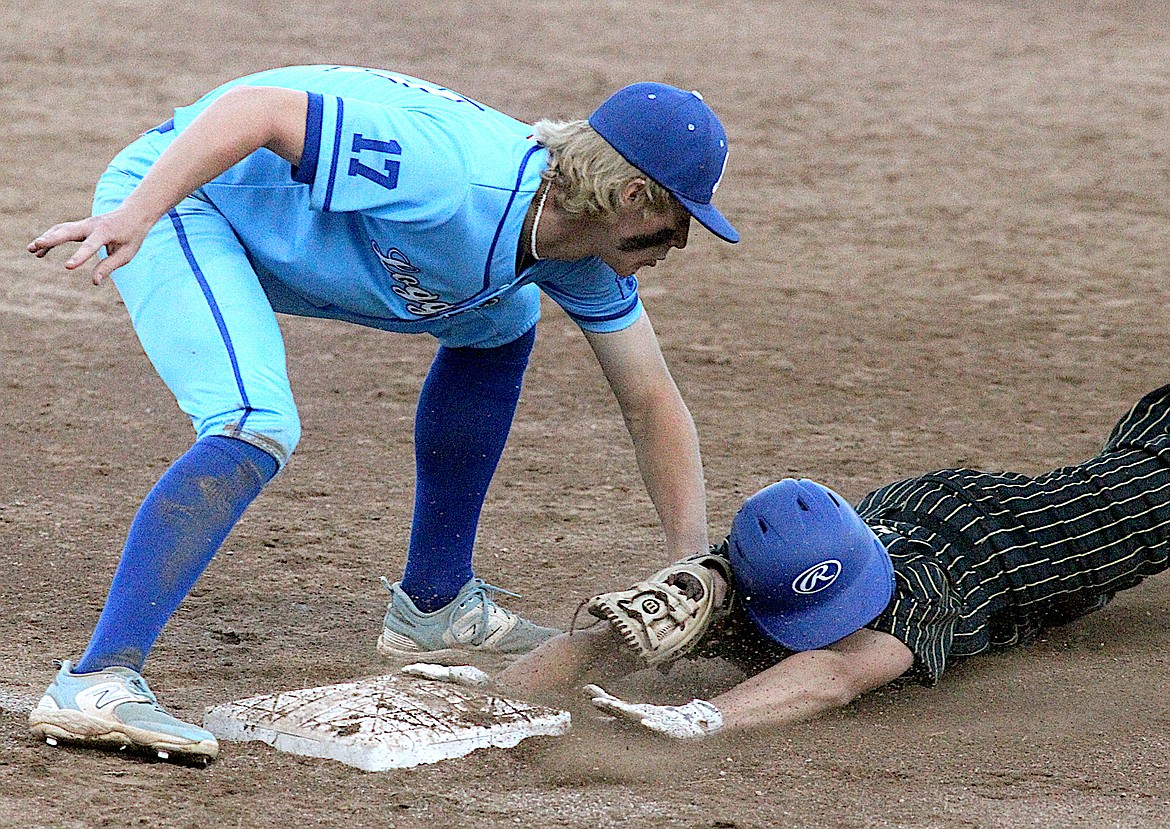 Libby third baseman Cy Williams puts the tag on the Central Alberta's Ayren Henry for the final out top of the seventh inning Saturday in a 2-1 win. (Paul Sievers/The Western News)