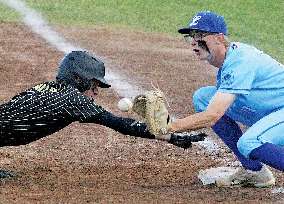 Central Alberta’s Graison Gallais stretches for the safety of first base as Libby's Tanner Wolfe checks his runner on a throw from pitcher Rusty Gillespie in the top of the seventh inning with no outs. The Loggers won, 2-1, Saturday during the Big Bucks Tournament at Lee Gehring Field. (Paul Sievers/The Western News)