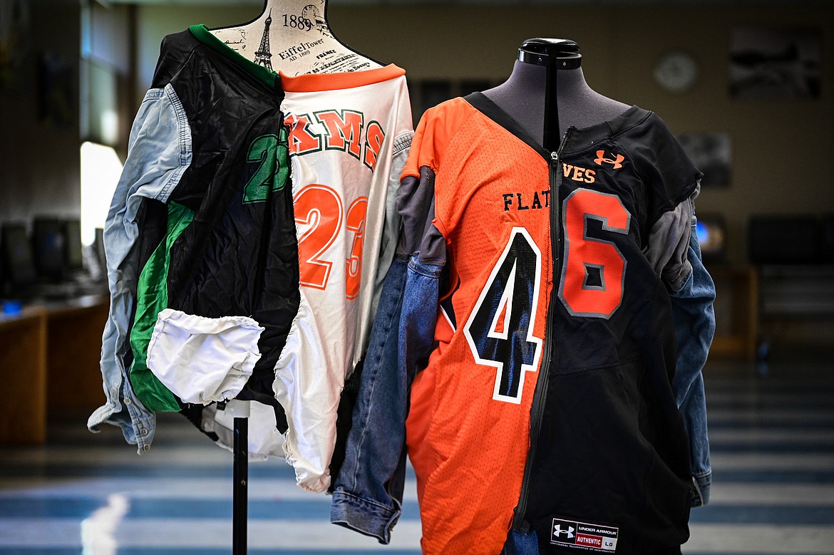 Flathead High School student Cassidy Hanson's sewing projects using repurposed athletic jerseys. The outfit on the right, which includes a skirt made from a denim jacket, won her a spot to compete at the Family, Career and Community Leaders of America National Conference held June 29 through July 3 in Seattle. The outfit on the left is an earlier version of the style Hanson sewed in middle school. (Casey Kreider/Daily Inter Lake)