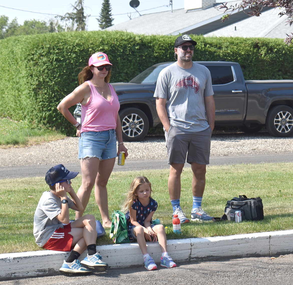 Parade watchers wait on the curb at the 2023 July 4 celebration in George.