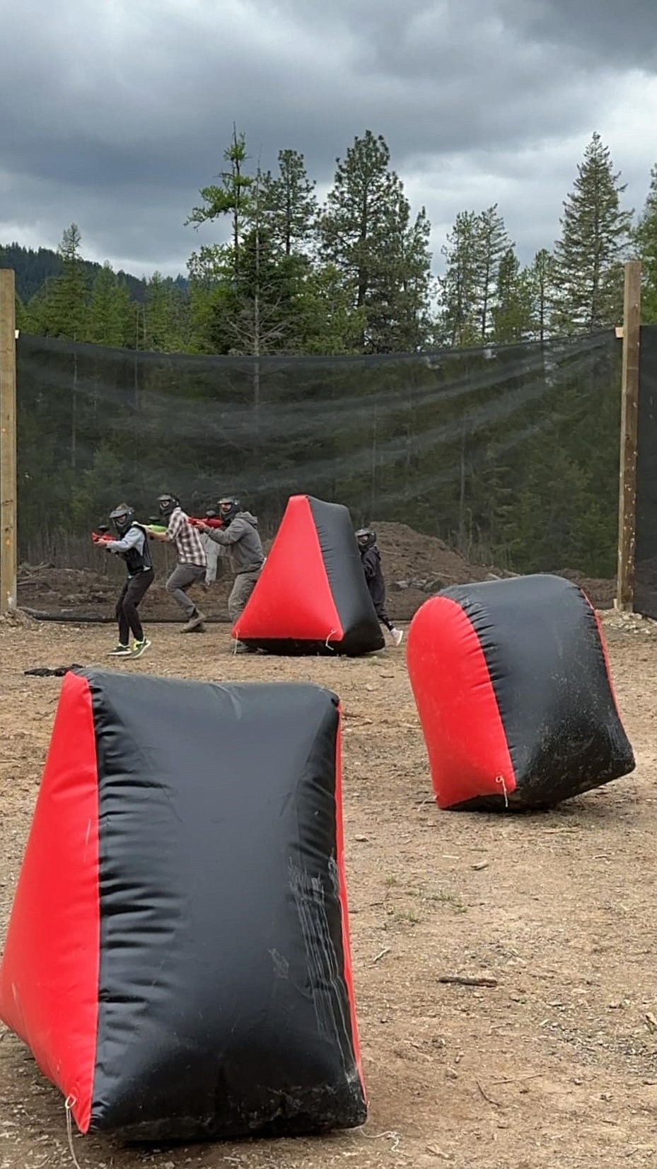 A trio of paintball enthusiasts are pictured at 7B Paintball's low impact course.