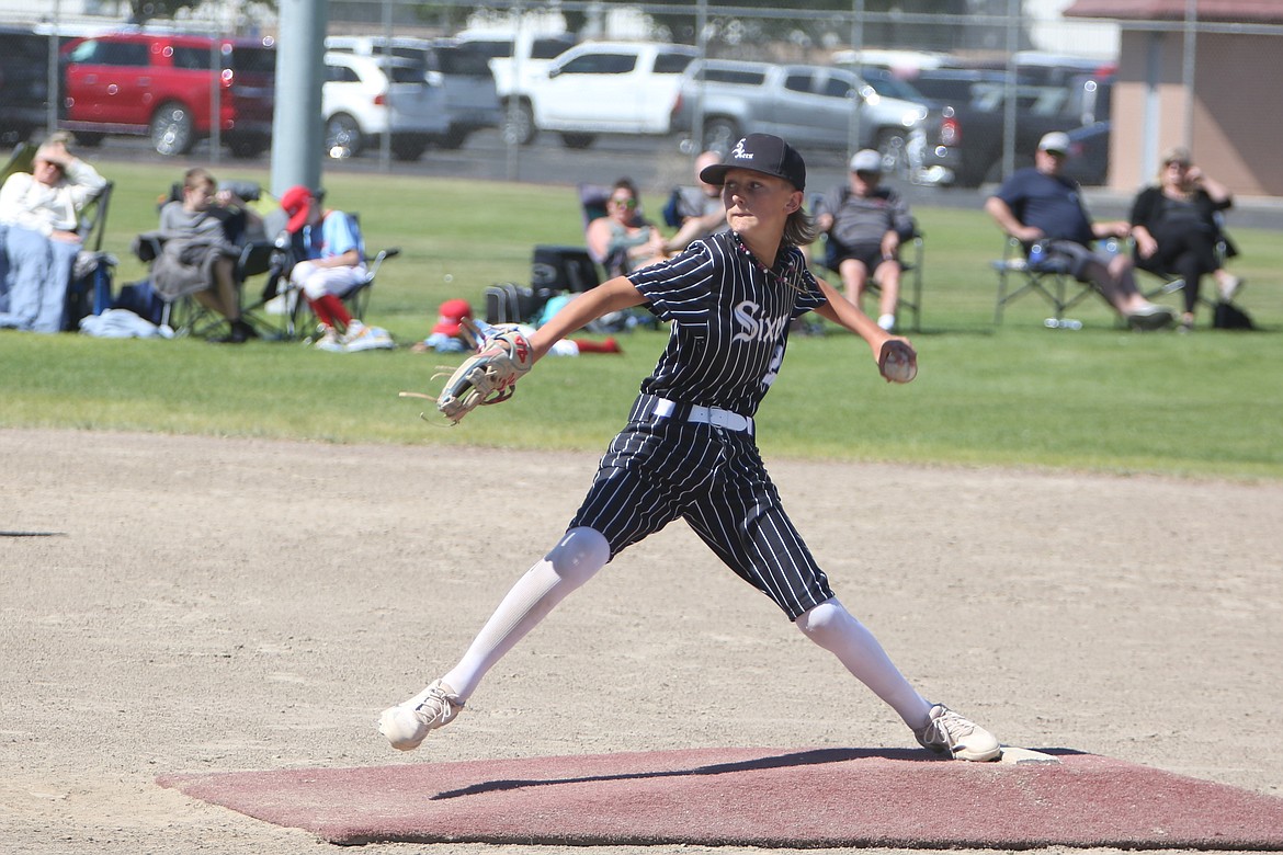 A pitcher for the 12U Central Washington Sixers winds up to pitch at the Pete Doumit Memorial Tournament in Moses Lake on June 16.