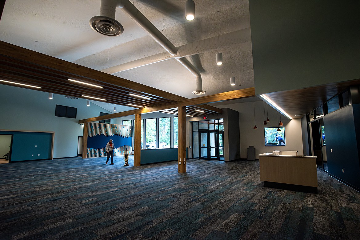 The new Bigfork Library front desk, soon to be accompanied by book shelves, sitting areas and a community meeting room, during the final stages of construction Friday, June 21. (Avery Howe/Bigfork Eagle)