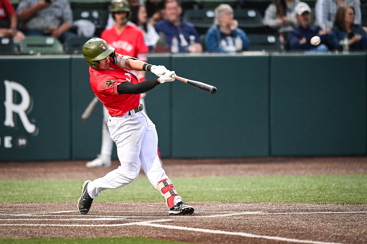 Glacier’s Christian Kirtley launches a three-run home run against Idaho Falls on June 14. Kirtley hit his eight, ninth and 10 homers Tuesday night in Missoula. (Casey Kreider/Daily Inter Lake)