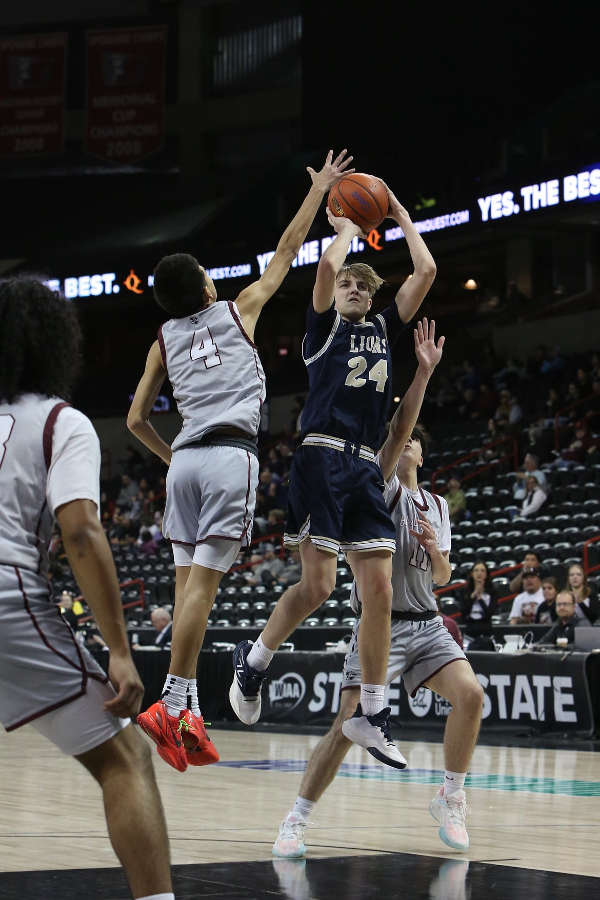 MLCA/CCS sophomore Johnny Ferguson (24) steps back to attempt a jump shot during the fourth/sixth-place game of the 1B Boys State Basketball Tournament against Lummi Nation in Spokane. Ferguson scored 27 points in the game.