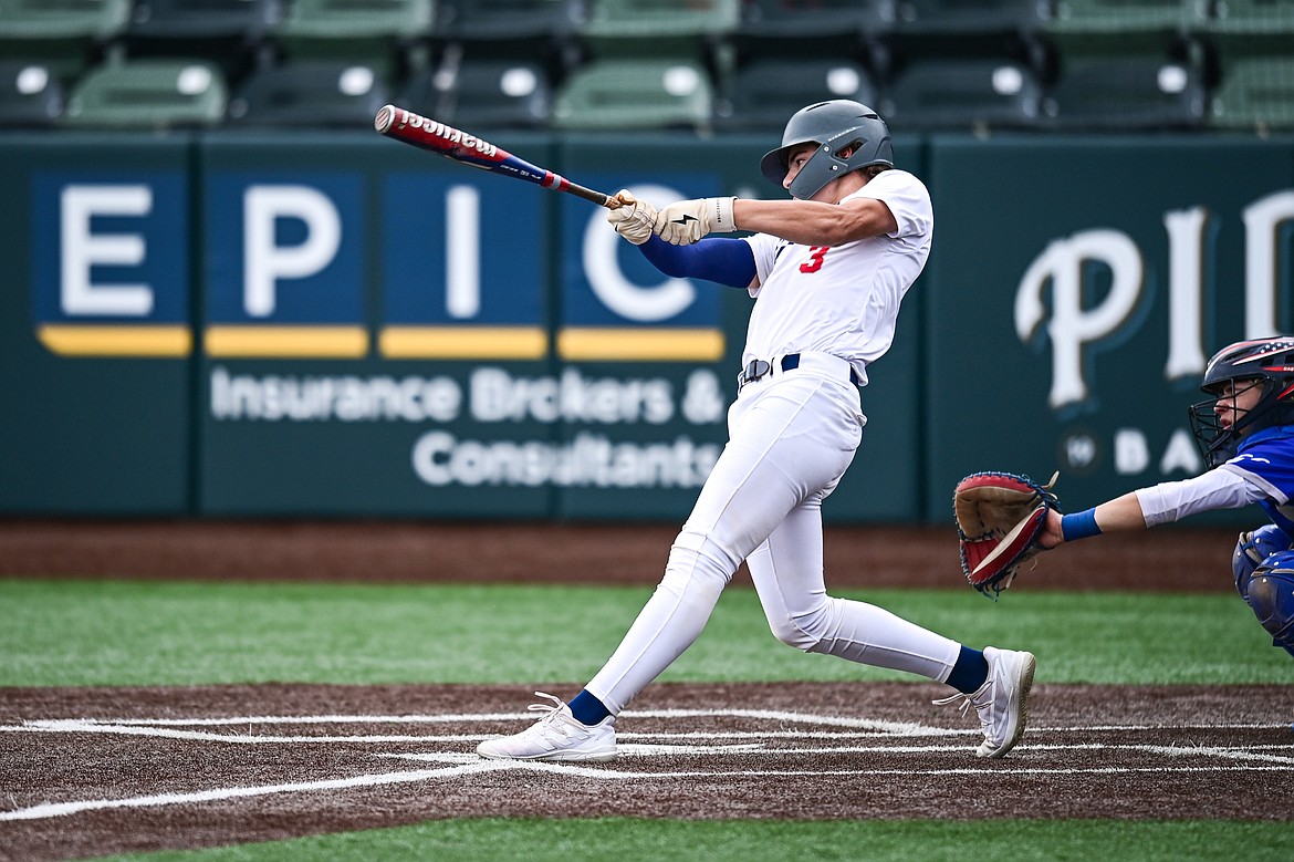 Badrock's Luke Dalen (3) drives in two runs in the third inning against Libby during the Badrock Invitational at Glacier Bank Park on Thursday, June 27. (Casey Kreider/Daily Inter Lake)