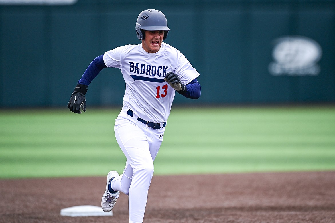 Badrock's Logan Stewart (13) heads toward third base on a two-run inside-the-park home run against Libby during the Badrock Invitational at Glacier Bank Park on Thursday, June 27. (Casey Kreider/Daily Inter Lake)