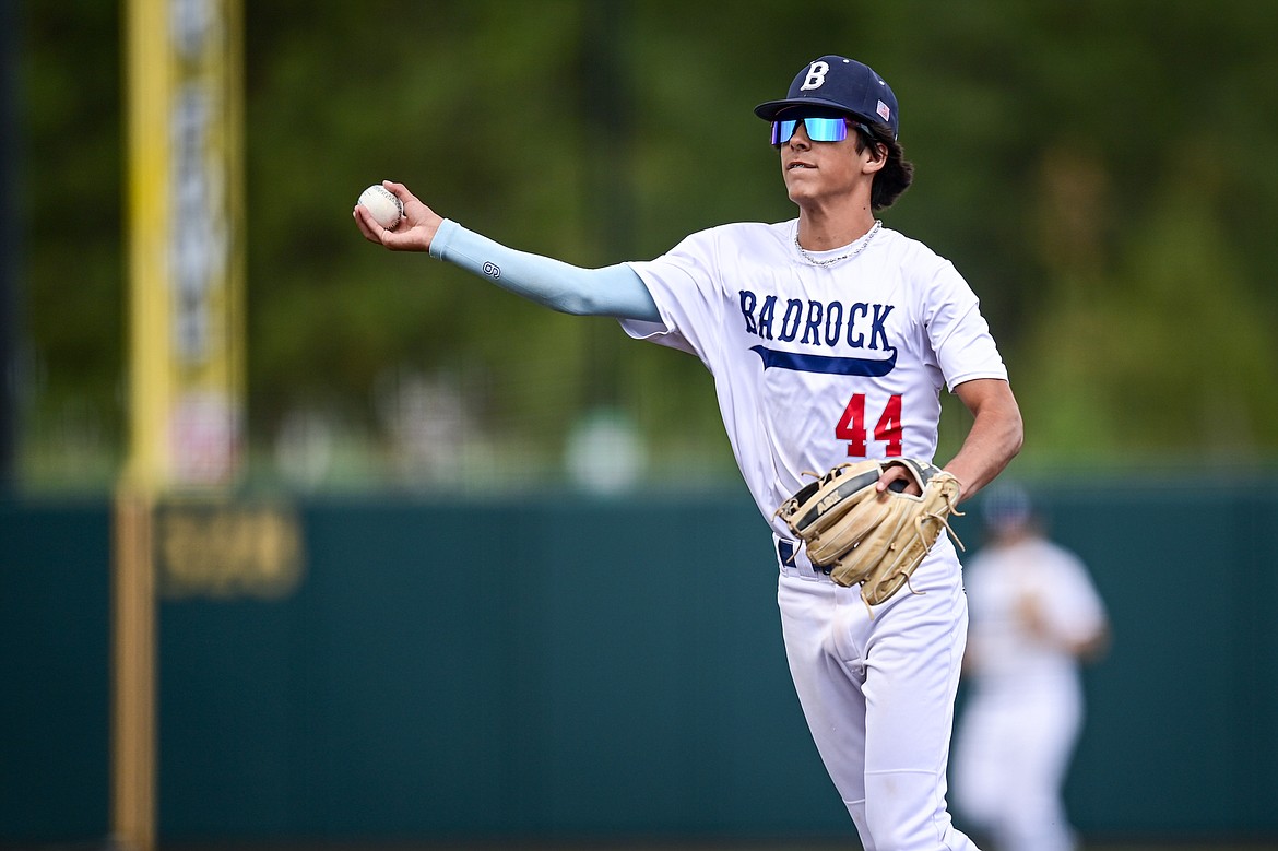 Badrock second baseman Carson Bramme (44) throws to first for an out against Libby during the Badrock Invitational at Glacier Bank Park on Thursday, June 27. (Casey Kreider/Daily Inter Lake)