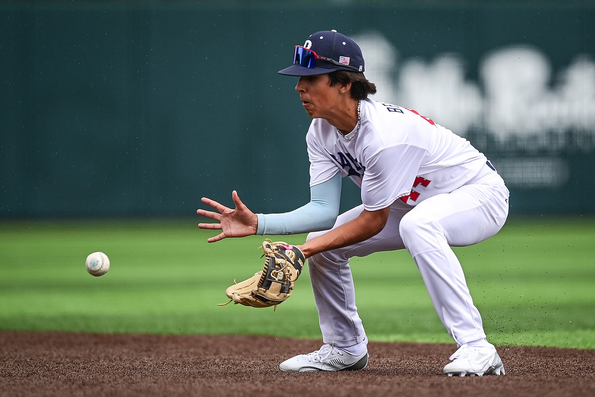 Badrock second baseman Carson Bramme (44) fields a grounder against Libby during the Badrock Invitational at Glacier Bank Park on Thursday, June 27. (Casey Kreider/Daily Inter Lake)