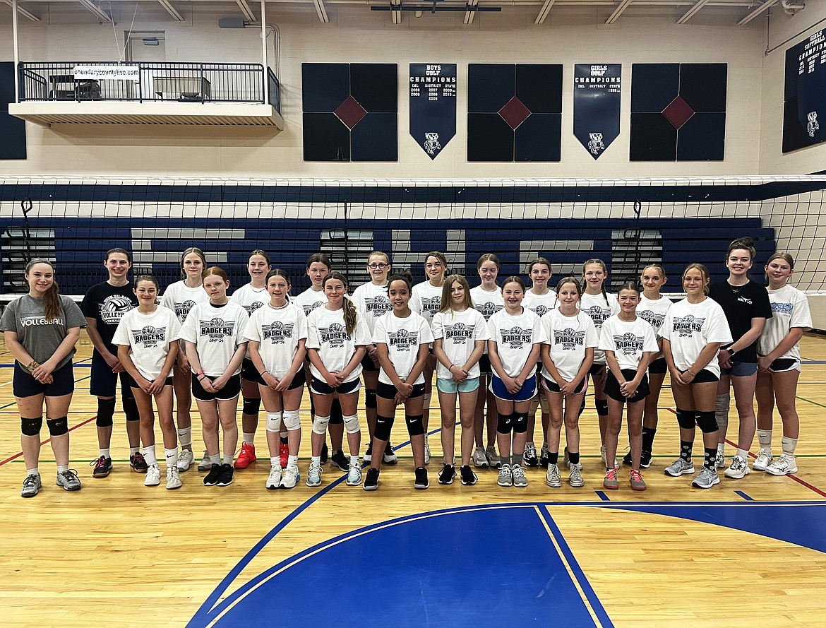 BFHS volleyball camp participants pose for a photo with BFHS volleyball players.