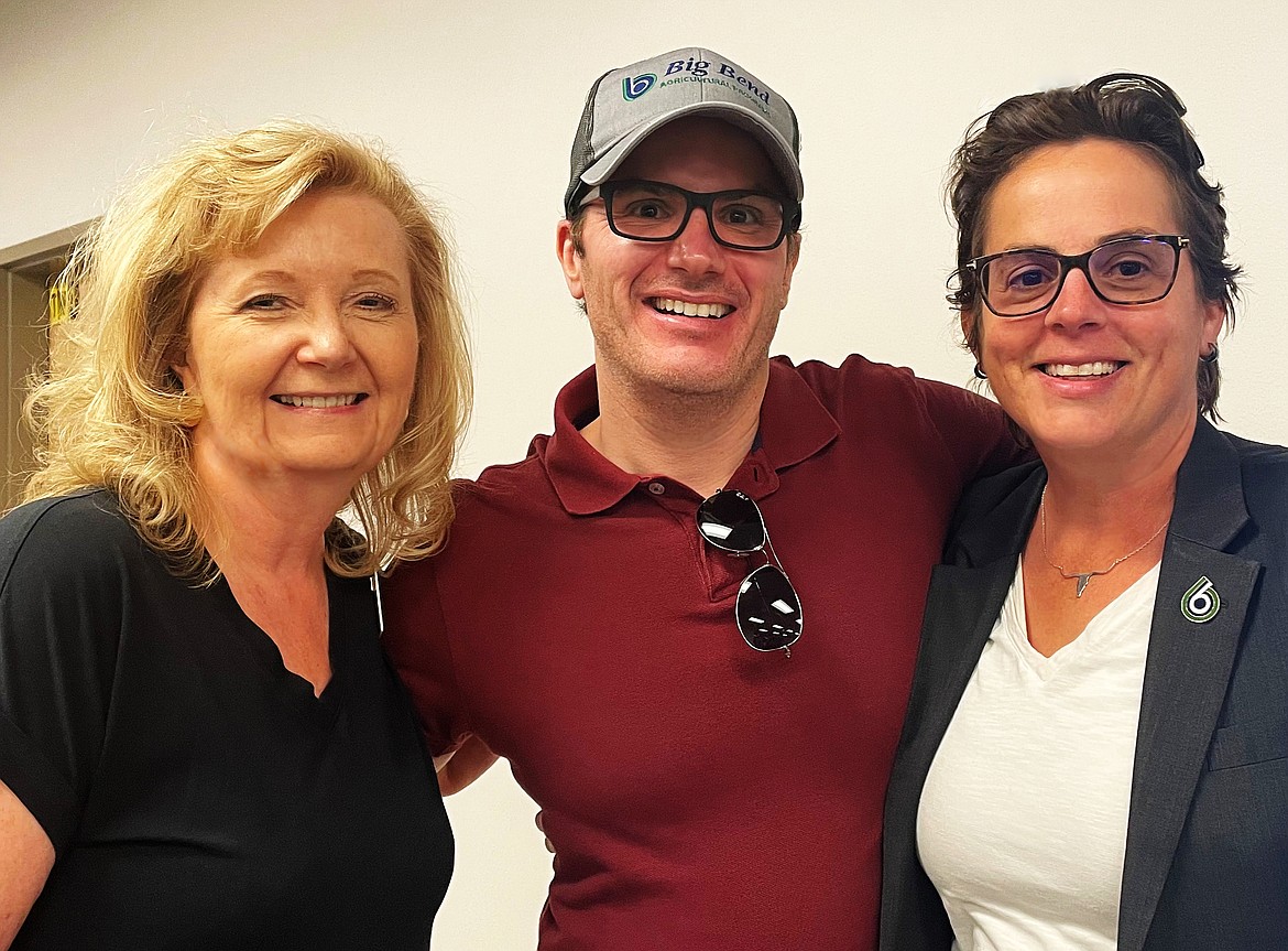 From left to right, LeAnne Parton, BBCC Foundation Executive Director, Dr. Aaron Mahoney, Agriculture and Chemistry Faculty, and Dr. Sara Thompson Tweedy, President of BBCC, pose for a photo after finding out Big Bend was the recipient of a $300,000 grant from the Lauzier Foundation for a new Greenhouse Learning Center.