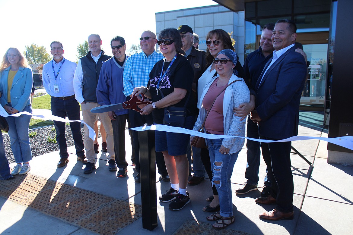 Gregg Fletcher, vice-president and administrator at the Confluence Health-Moses Lake Clinic, second from left, at the ribbon cutting for the organization’s radiation treatment center in Moses Lake.