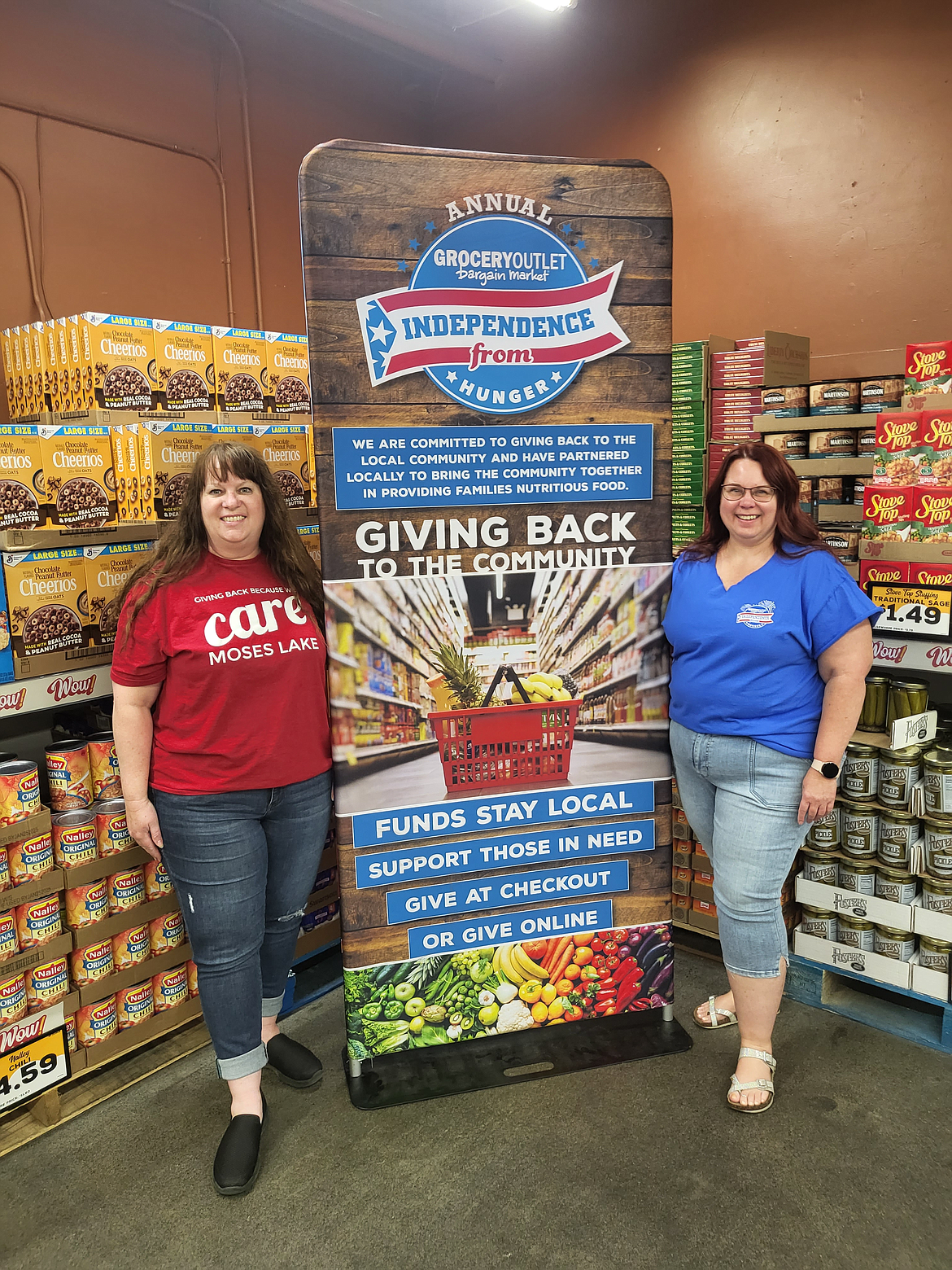 Moses Lake Grocery Outlet co-owner Kris Emerson, right, and Care Moses Lake Director Michaelle Boetger, left. The Grocery Outlet and Care Moses Lake are working on the “Independence from Hunger” food drive, which will be collecting donations through July 31.