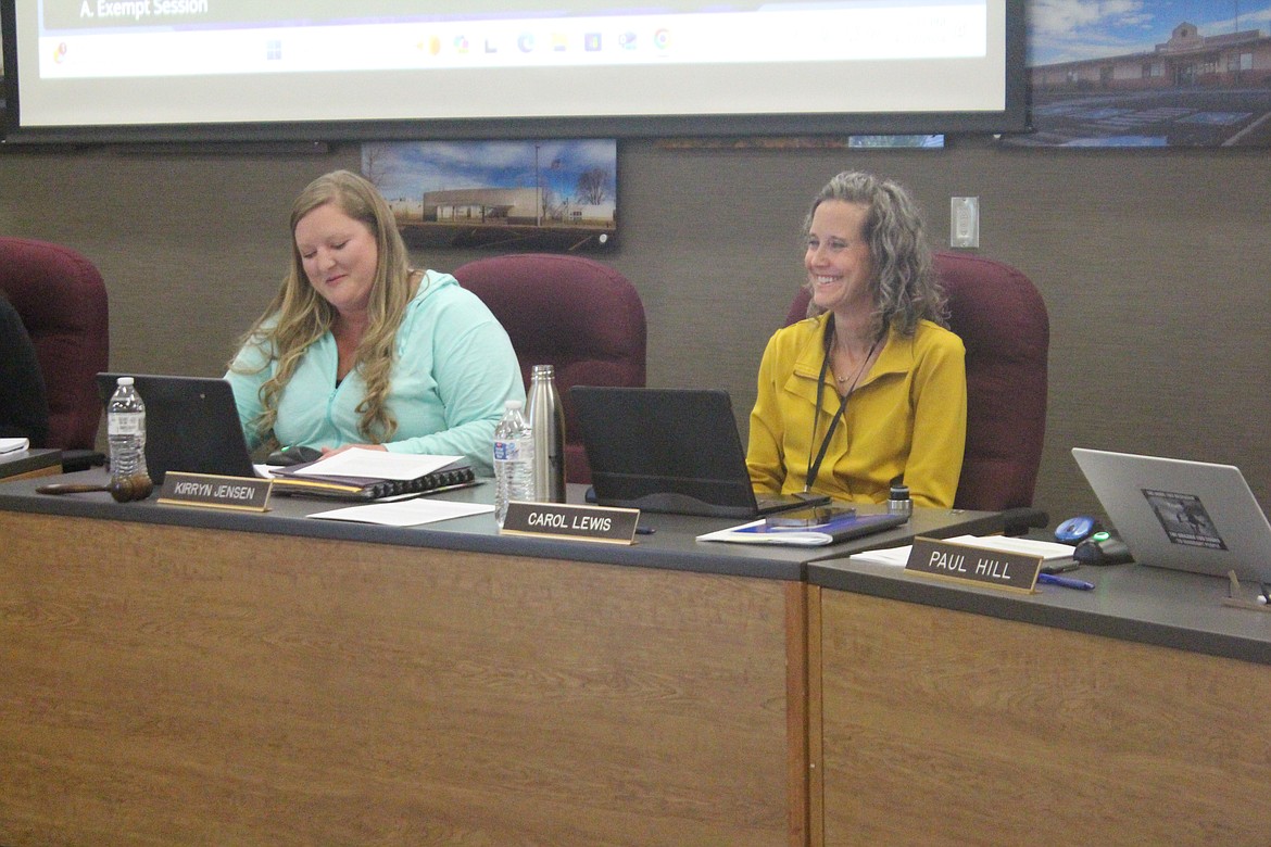 Carol Lewis, right, was named interim superintendent of the Moses Lake School District at the regular Moses Lake School Board meeting Thursday. Board chair Kirryn Jensen, left, reads the announcement.