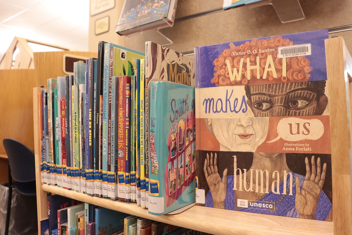 "What Makes Us Human" by Victor D.O. Santos is among the stacks in the children's library at the Coeur d'Alene Public Library.
