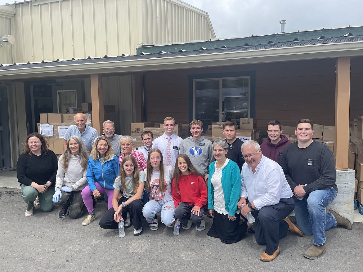 Volunteers gather for a photo as they prepare to receive a donation of 22 pallets of shelf-stable basic groceries from the Church of Jesus Christ of Latter-day Saints.