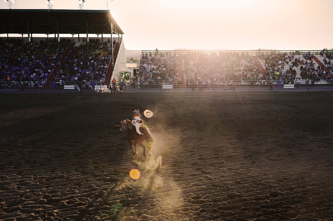 Spur Lacasse, from Calgary, Alberta, Canada, rides The Liberator during bareback riding at the Northwest Montana Fair & Rodeo at the Flathead County Fairgrounds in Kalispell on Saturday, Aug. 22. (Casey Kreider/Daily Inter Lake)