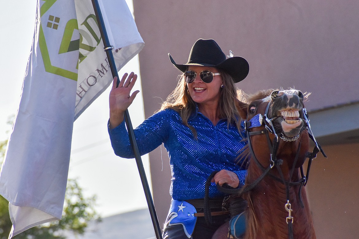 Rider and horse both smile for the camera at the 2023 Suds ‘N Sun parade.