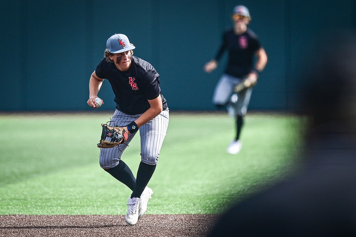 Kalispell Sluggers' shortstop Kaeden Kahler (22) readies a throw to first base against Badrock during the Badrock Invitational at Glacier Bank Park on Saturday, June 29. (Casey Kreider/Daily Inter Lake)