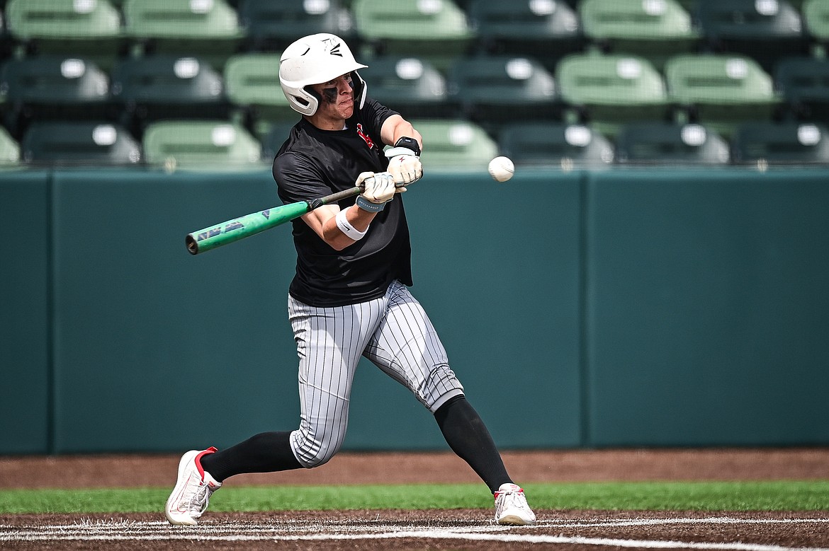 Kalispell Sluggers Nico Young drives in two runs with a single against Badrock during the Badrock Invitational at Glacier Bank Park on Saturday, June 29. (Casey Kreider/Daily Inter Lake)