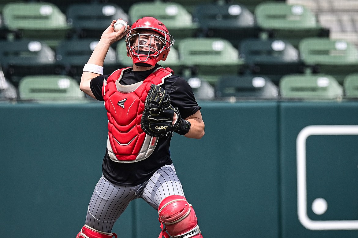 Kalispell Sluggers catcher Nico Young (4) throws to first for a home-to-first double play attempt against Badrock during the Badrock Invitational at Glacier Bank Park on Saturday, June 29. (Casey Kreider/Daily Inter Lake)