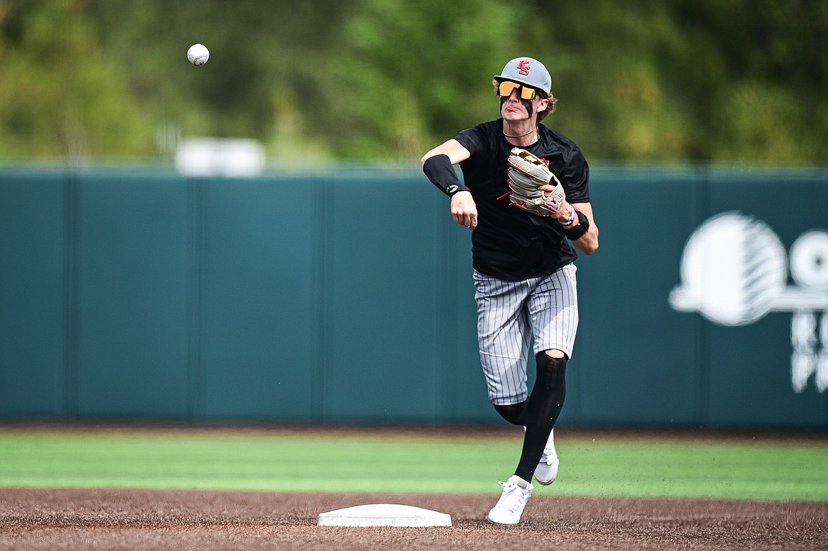 Kalispell Sluggers shortstop Cooper Pelc (8) throws to first base against Badrock during the Badrock Invitational at Glacier Bank Park on Saturday, June 29. (Casey Kreider/Daily Inter Lake)