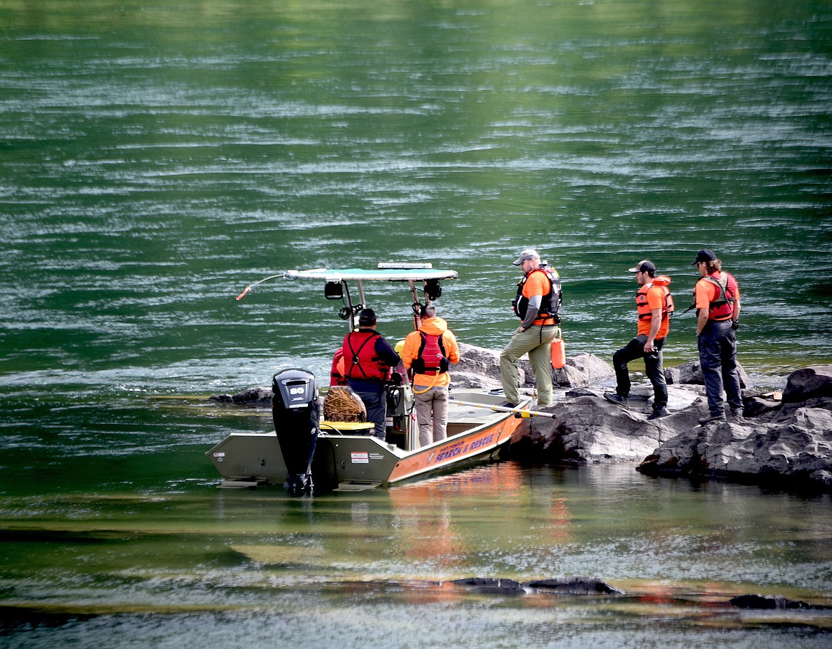 Members of David Thompson Search and Rescue work on the Kootenai River below China Rapids Saturday, June 29, 2024, in an effort to find a woman who went missing June 26 during a kayaking trip. (Scott Shindledecker/The Western News)