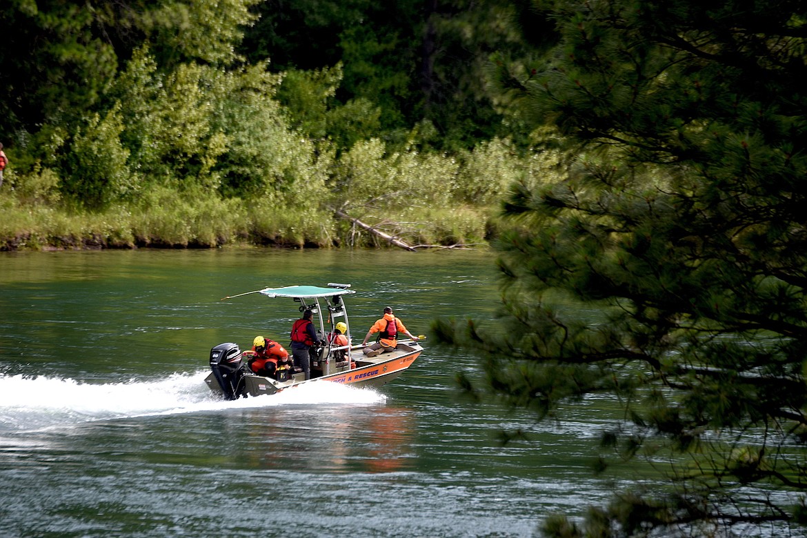 A David Thompson Search and Rescue boat heads up the Kootenai River below China Rapids Saturday, June 29, 2024, in an effort to find a woman who went missing June 26 during a kayaking trip. (Scott Shindledecker/The Western News)