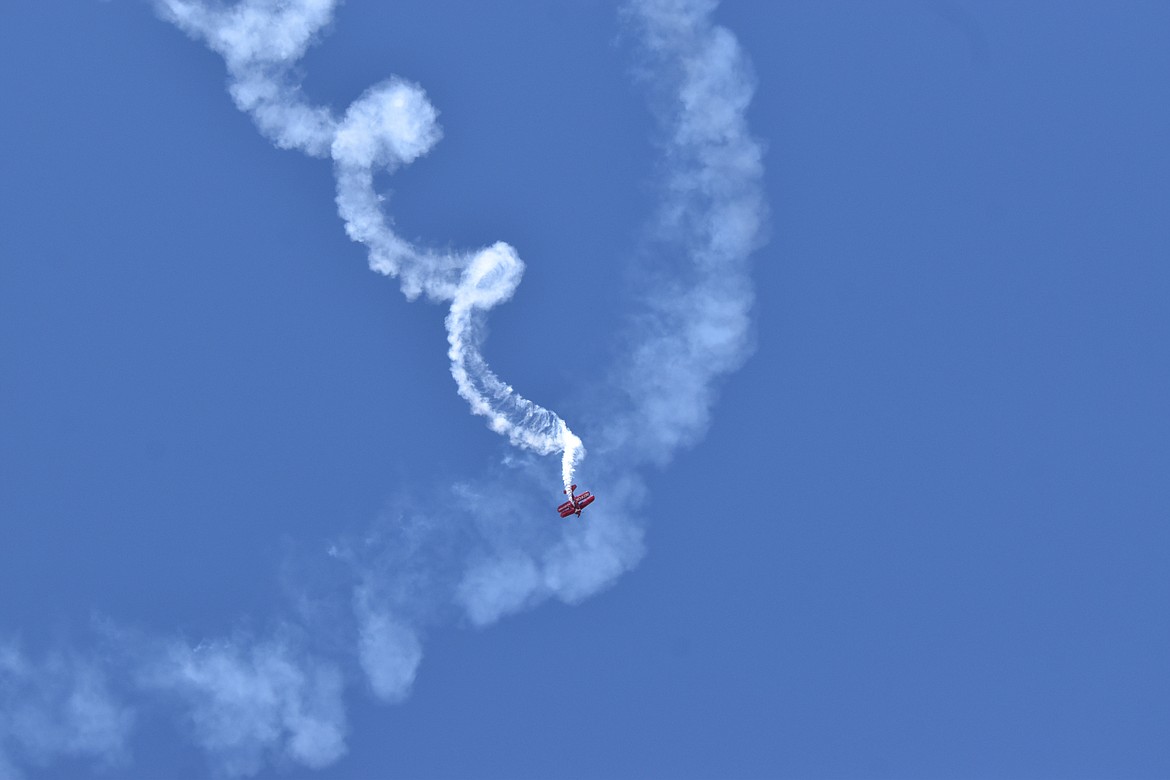 A pilot spins a smoke spiral at the Moses Lake Airshow in June. This week will see clear skies and hot weather, especially later in the week with a highs in the 90s from Independence Day through Saturday.