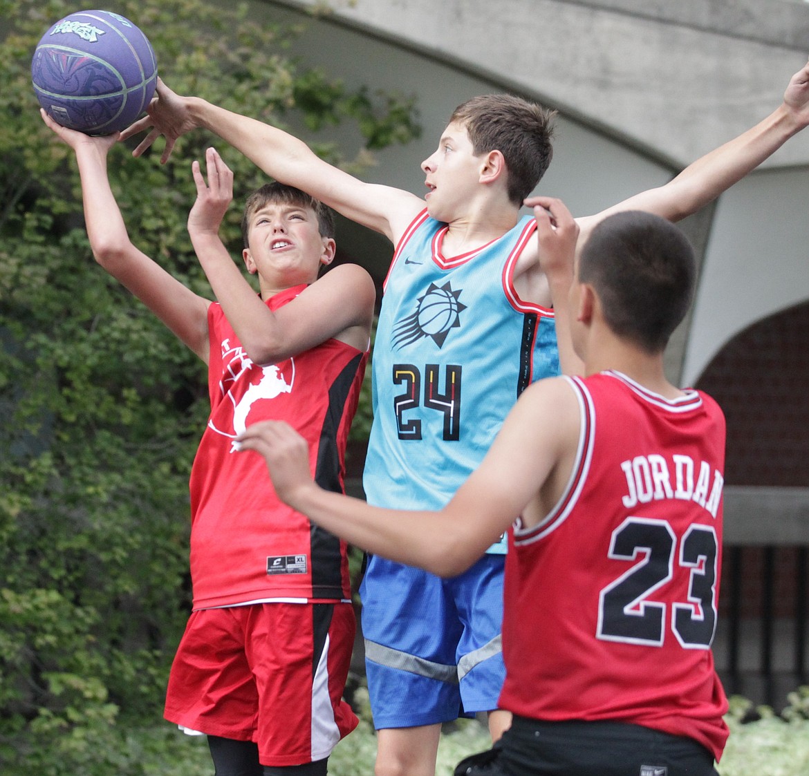 JASON ELLIOTT/Press
Sandpoint Hoopers player Bennett Nieman goes up for a shot during an opening round game against Wild Catz at the Hoopfest 3-on-3 basketball tournament in Spokane on Saturday.
