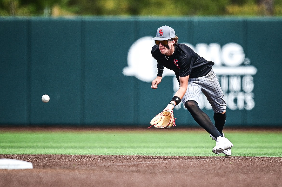 Kalispell Sluggers shortstop Cooper Pelc (8) fields a ground ball against Badrock during the Badrock Invitational at Glacier Bank Park on Saturday, June 29. (Casey Kreider/Daily Inter Lake)