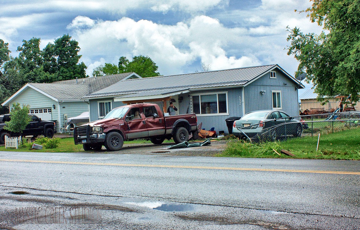 The aftermath of a law enforcement pursuit on Kelly Road near Kalispell is seen in this courtesy photo. Flathead County Sheriff Brian Heino said deputies began chasing the suspect about 11:30 p.m., June 29 following a report of a motorist driving without headlights. (Photo courtesy Patrick Booth/Mystic Creek Studios)