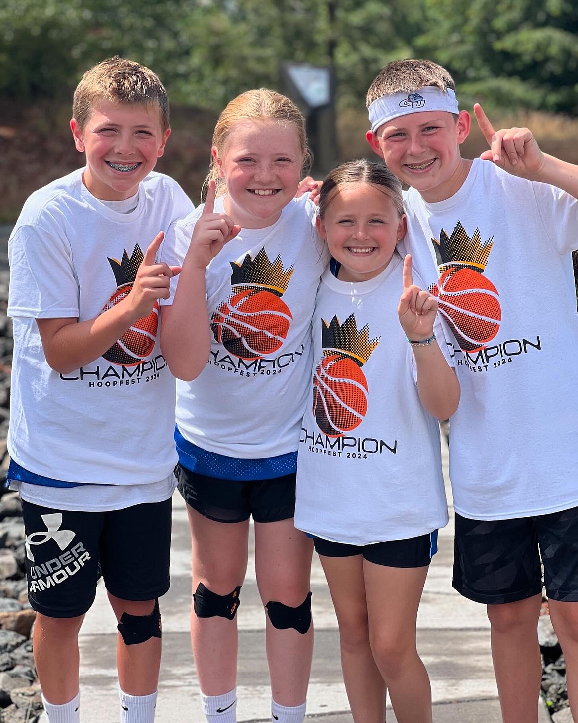 Courtesy photo
Team Fam-Bam, a pair of brother/sister combos from Coeur d'Alene, won their sixth grade coed bracket at Hoopfest in downtown Spokane last weekend. From left are Levi Drake, Maddie Drake, Quinn Burrill and Cody Burrill.