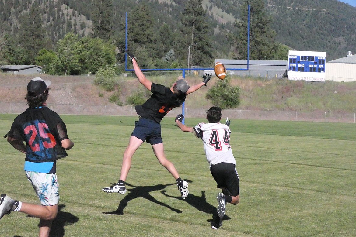 A Plains defender goes high to swat away a possible touchdown pass during the Horsemen's Passing League game versus Darby last Monday in Superior.  (Chuck Bandel/VP-MI)