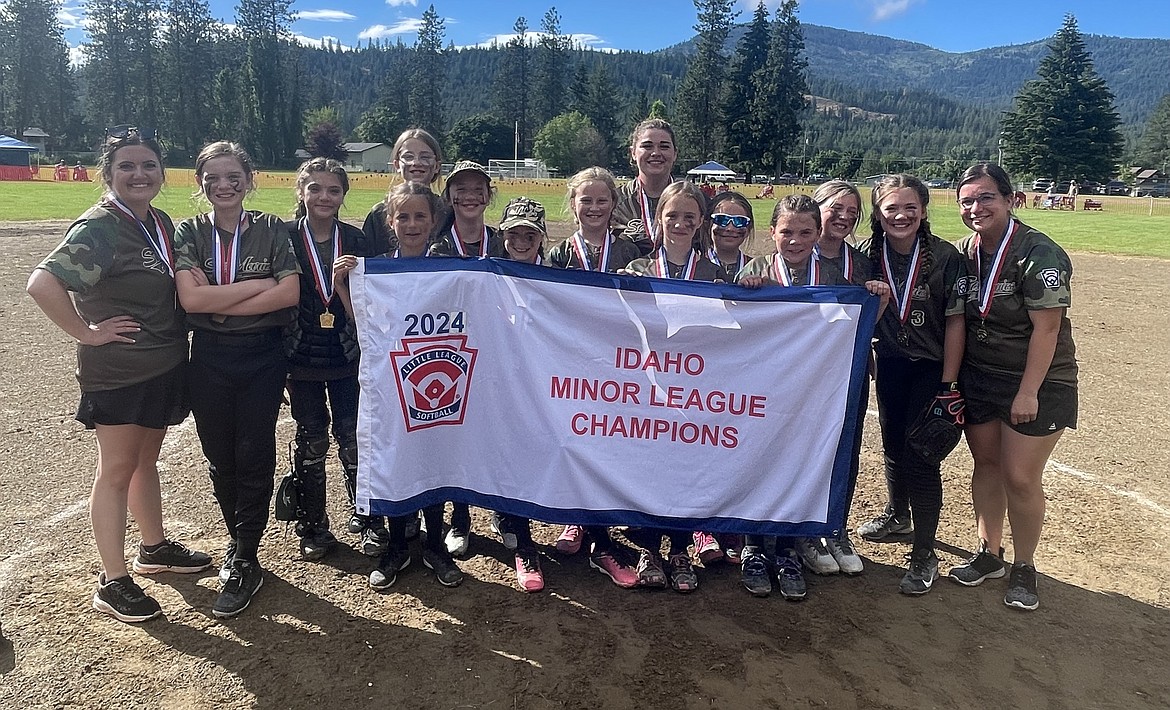 Courtesy photo
St Maries won the Idaho District 1 10U softball championship last weekend at Stub Myers Park in Rathdrum to advance to the state playoffs July 12-14 at the Charles F. McDevitt Youth Sports Complex in Boise. In the front row from left are coach Brittany Nelson, Abby Jo Freeman, Josie Dippolito, Olivia Bonds, Kennadie Baker, Brooke Plante, Amelia Wicks, Zoey Coelho, Mary-Ellen Hand, Hope Grosvenor, Elsie Flesher, Camryn Charles and manager Chelsea Whitford; and back row from left, Remy Smith and coach Stormi Lockridge.