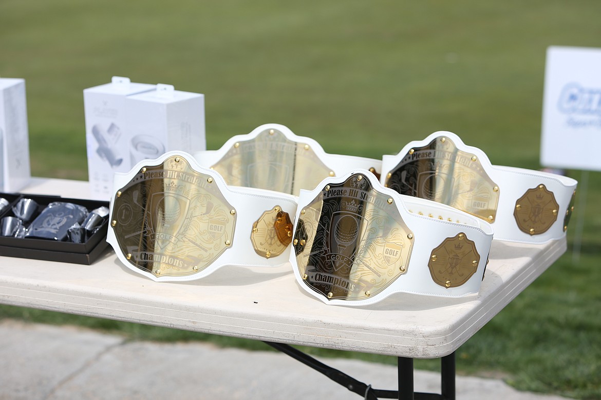 The winners of the Please Hit Straight golf tournament received WWE-style championship belts.