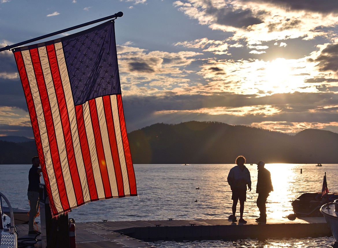 The rain showers cleared for a spectacular sunset during the Woody Weekend boat parade Friday. (Kelsey Evans/Whitefish Pilot)