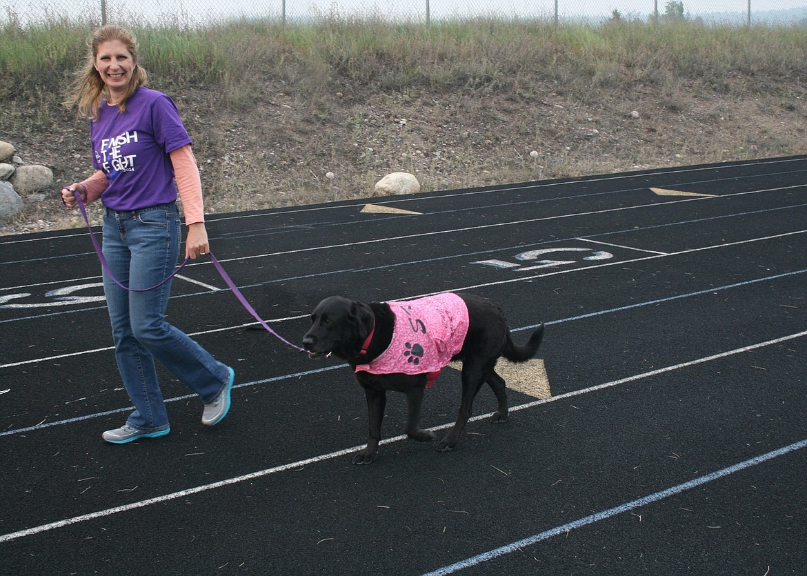 Michelle Weltz and her dog Sky walk the Bigfork Relay for Life in 2015. (Courtesy photo)