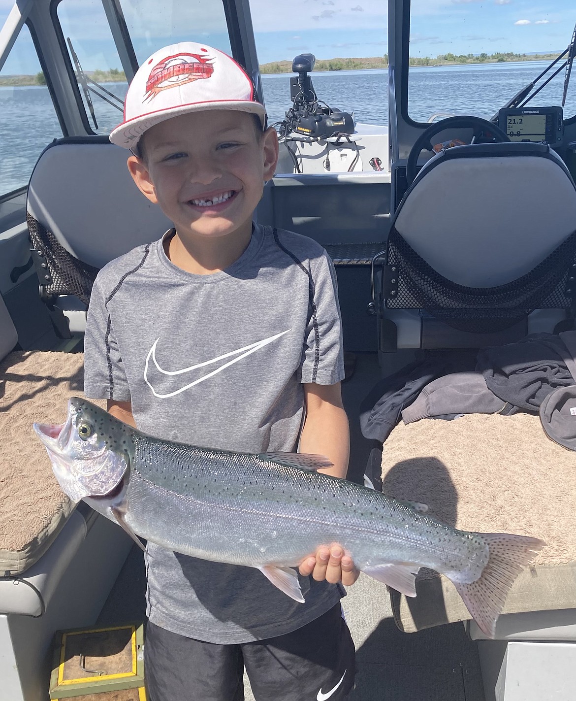 A young angler shows off a nice four-pound rainbow trout caught while trolling Potholes Reservoir. This was one of 10 trout the family caught that day.