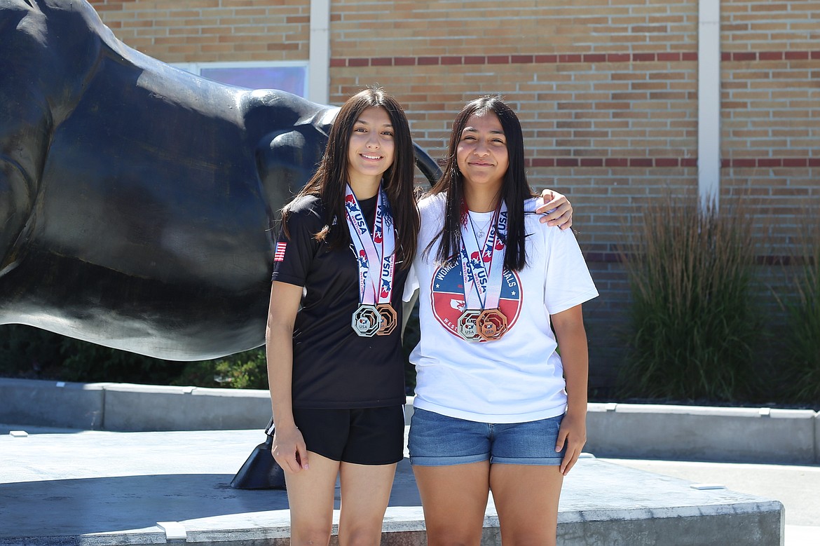 Sophia Garza, left, and Anahi Garcia, right both competed for the 14U Washington Girls wrestling team at last month’s USA Wrestling Women’s National Duals tournaments in Westfield, Indiana.