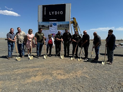 From left, former Grant County Sheriff Ryan Rectenwald, County Maintenance Manager Kevin Schmidt, County Commissioner Cindy Carter, County Commissioner Rob Jones, former commissioner Carolann Swartz, GCSO Chief Deputy Phil Coates, Undersheriff John McMillan, Sheriff Joey Kriete, former Sheriff Tom Jones, Director of Central Services Tom Gaines and County Commissioner Danny Stone get ready to turn some dirt at the groundbreaking ceremony for the new Grant County Jail June 20.