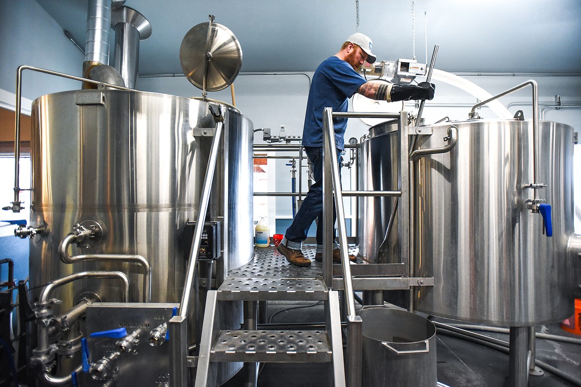 Seth Orr, head brewer at Sacred Waters Brewing Company, starts a brew at the brewery. (Casey Kreider/Daily Inter Lake)