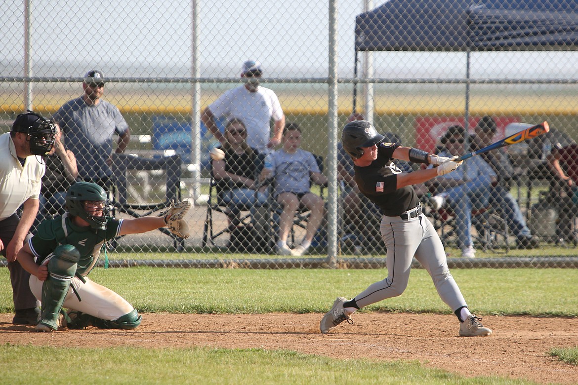 Almira/Coulee-Hartline Legion’s Harvest Parrish swings at a pitch during a doubleheader against East Valley on June 21.