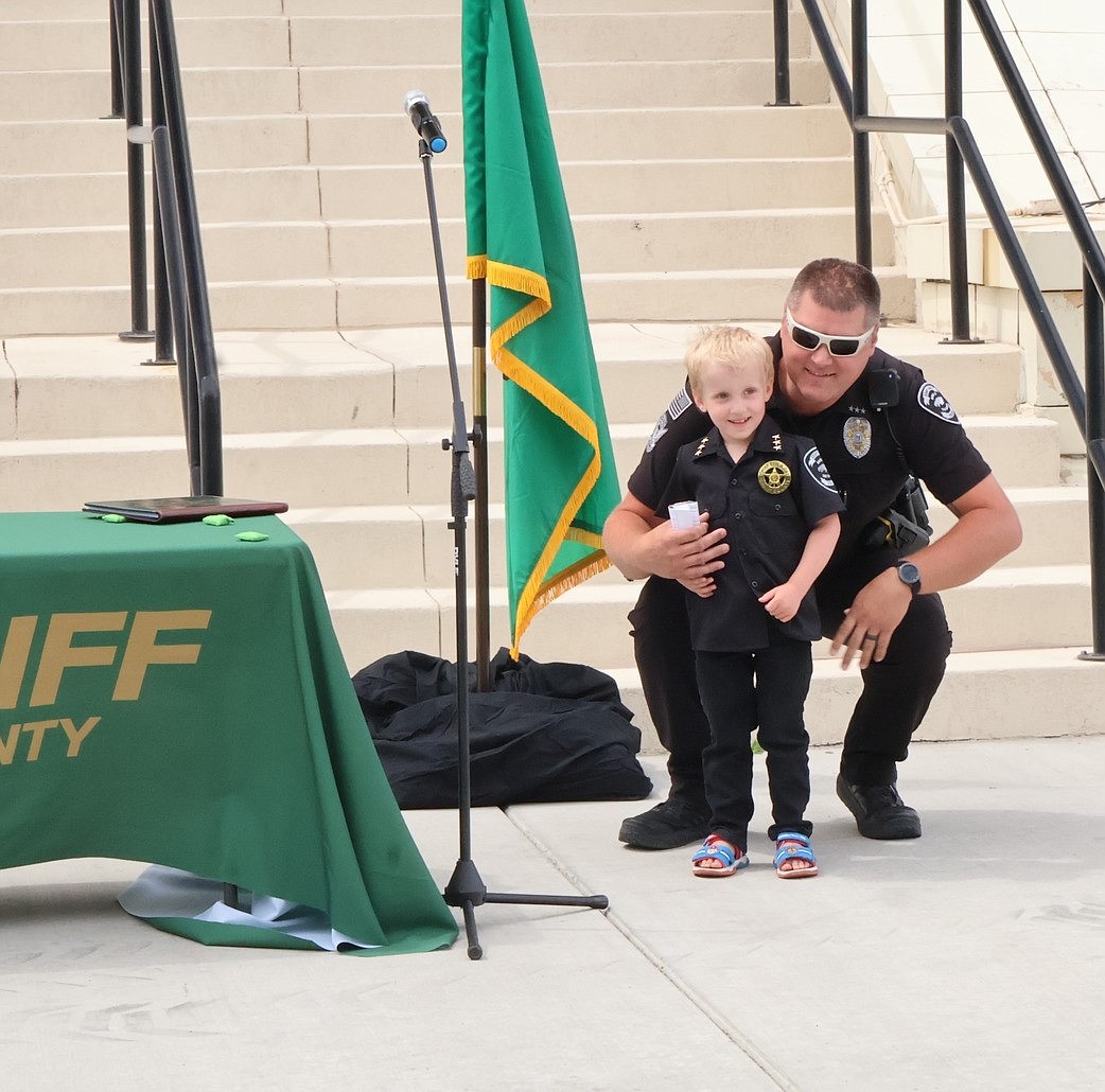 Soap Lake Police Chief Ryan Cox poses with Chief Locklan - Soap Lake's Chief for a Day 2024 - on June 6. Cox said the event is a way for officers to connect with children and make sure they feel recognized and acknowledged.