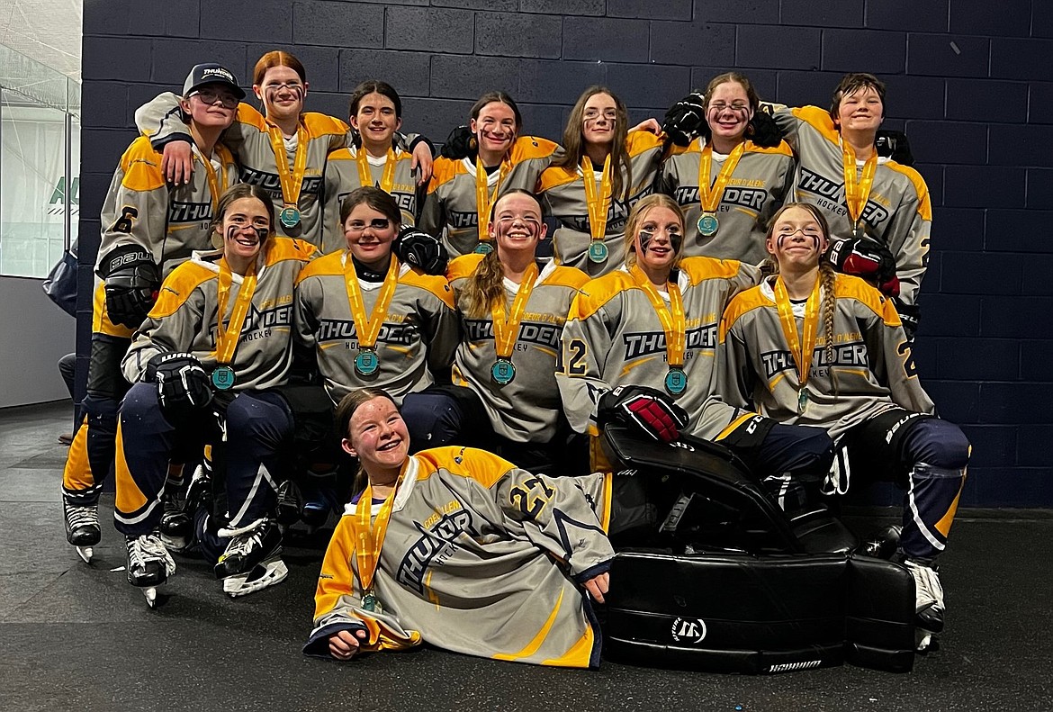 The Coeur d'Alene Lady Thunder hockey team poses after a 2023 MLK Winter Classic win in their division in Boston. Front: Kylie Jaksha (goalie); second row from left: Lucy Spiess, Carlyn Butterfield, Baylee Carpenter, Danika Johnson and Charlie Groff; back row: Norah Adoretti, Ailey George, Elsa Jehle, Mickayla O'Hara, Brooklyn Gentz, Cordelia Perkins and Logan Greene.