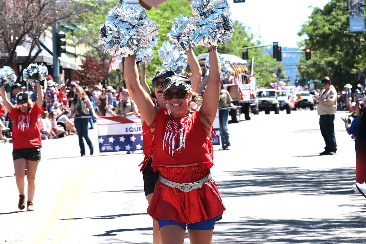 Heidi Frazier performs a hip-hop routine with colleagues during the American Heroes parade on Thursday.