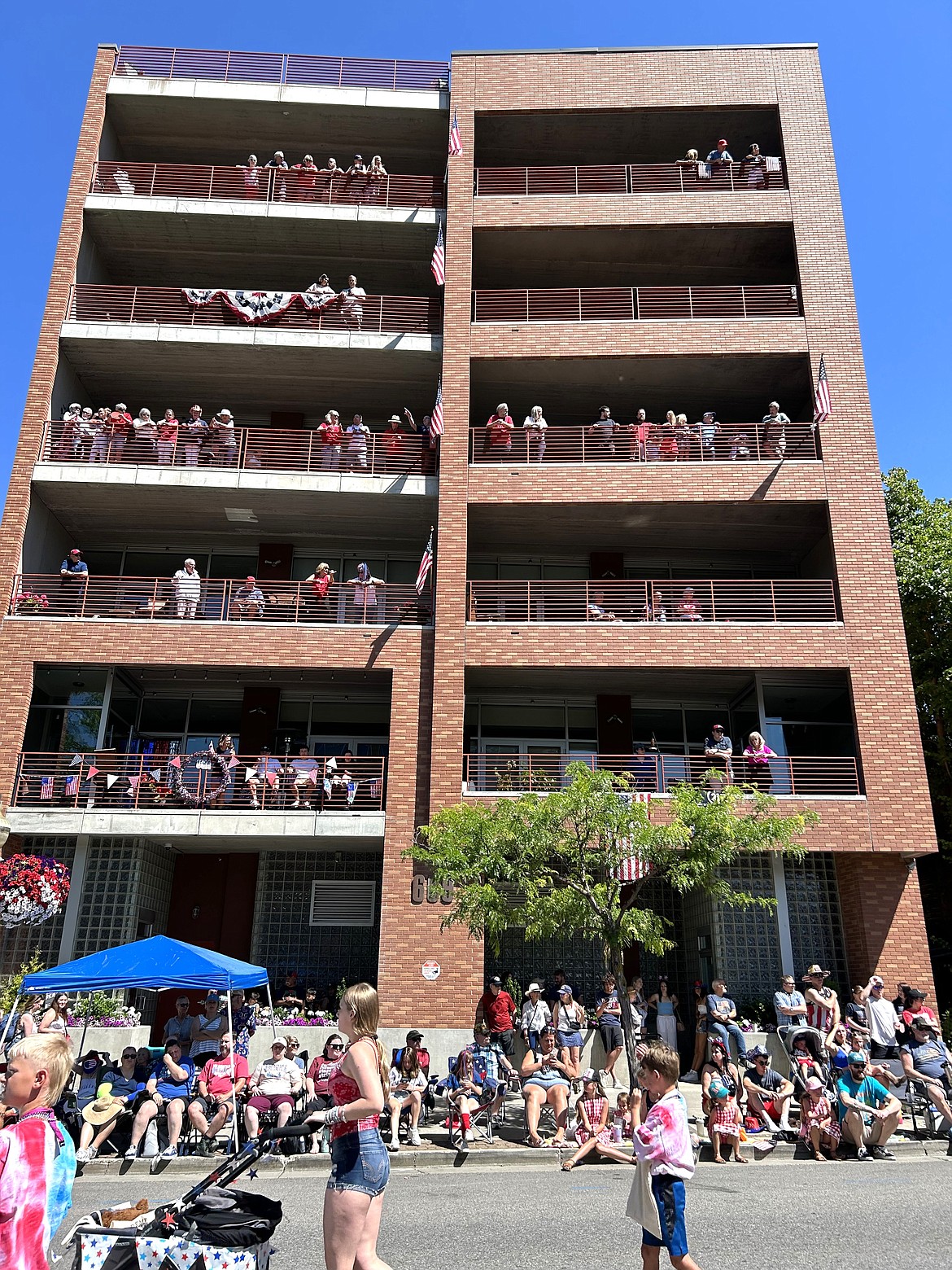 Spectators watch the parade from above.